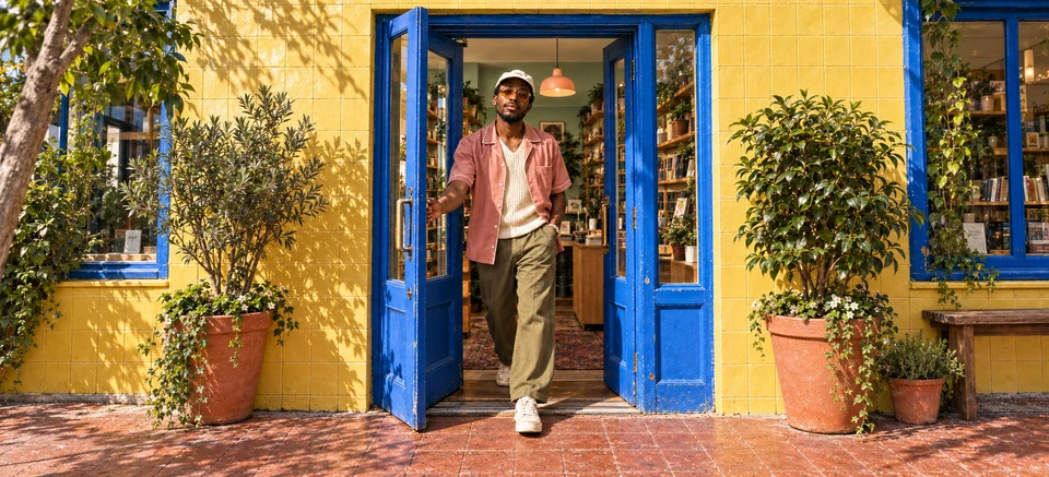 Acend concept photograph outside a yellow and cobalt shopfront.